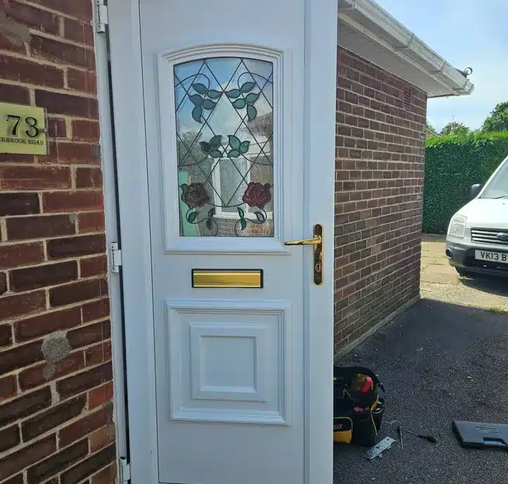 White door with brass post box