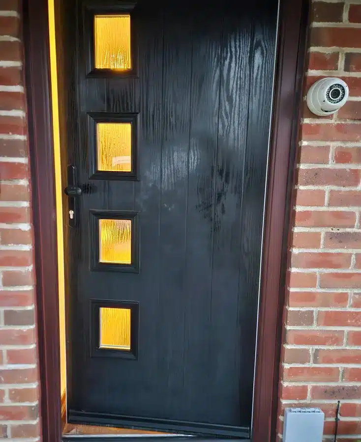 locksmith Black wooden door with black handles