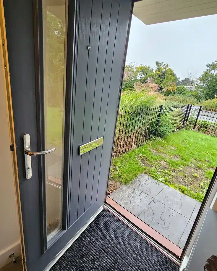 Wooden door with glass window in dark blue color