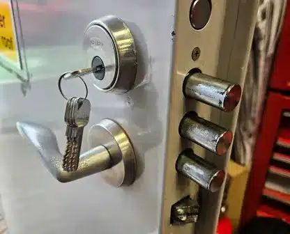 a key lock on a metal door and lock with keys